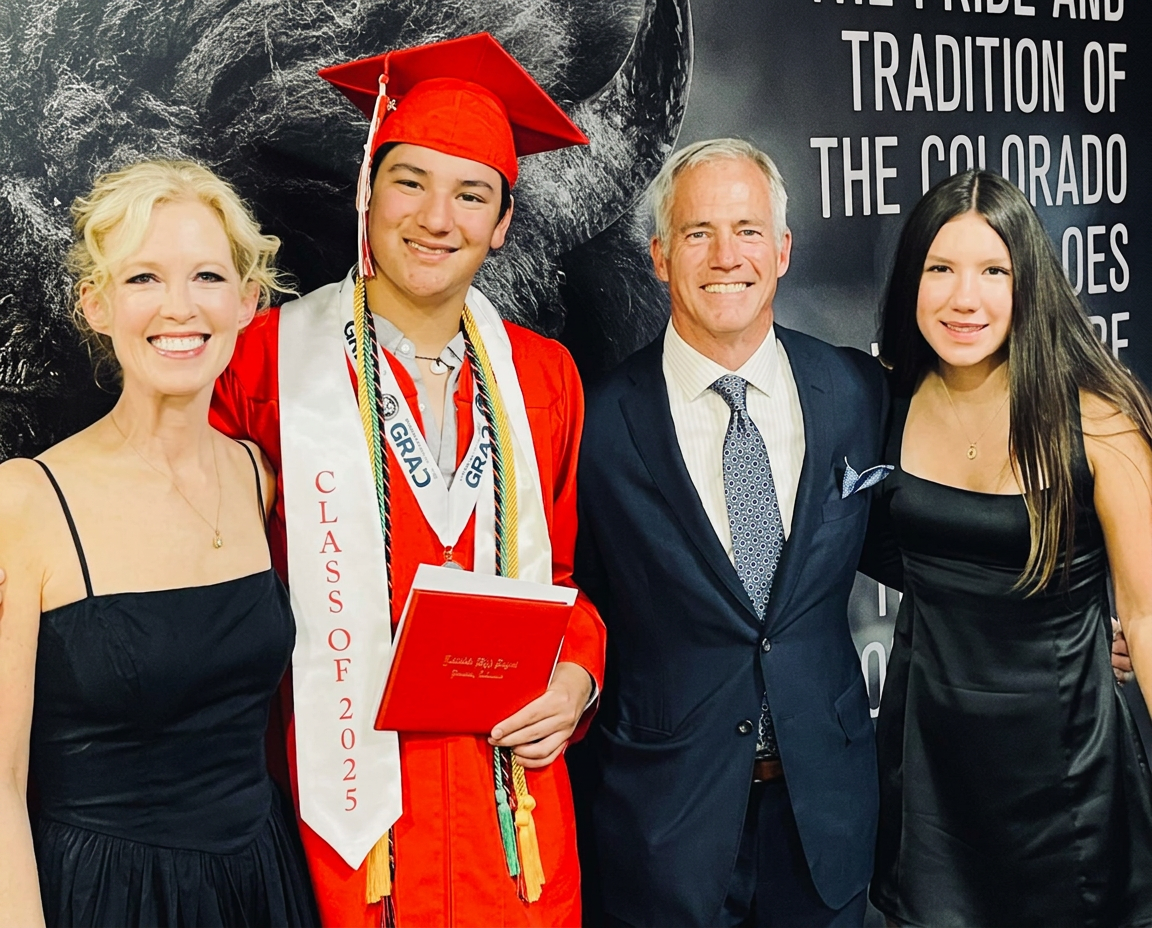 Scott Rendleman with his family at a graduation ceremony.